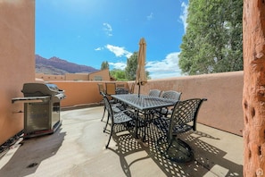 Enjoy al fresco dining on the patio with a barbecue grill and comfortable seating.