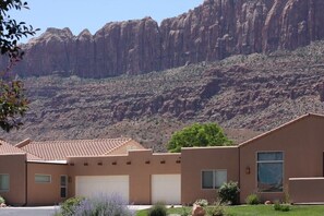 Situated in a natural setting, this single-story building offers scenic views and a well-manicured lawn.