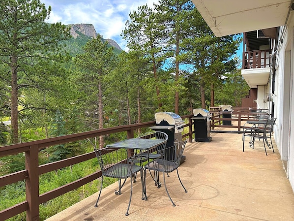 Guests can enjoy al fresco dining on the patio, which features a grill and comfortable seating for four.