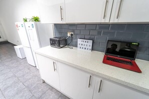 Accommodating kitchen space with a countertop for cooking and working.