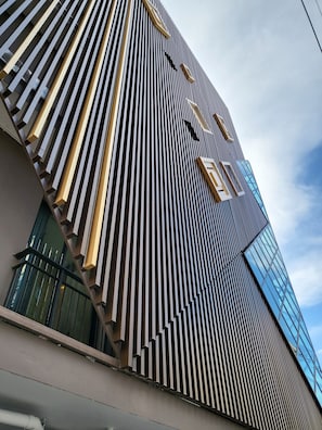 A modern building with a vertical striped facade and large windows. - S3 Siam Bangkok (Bangkok)