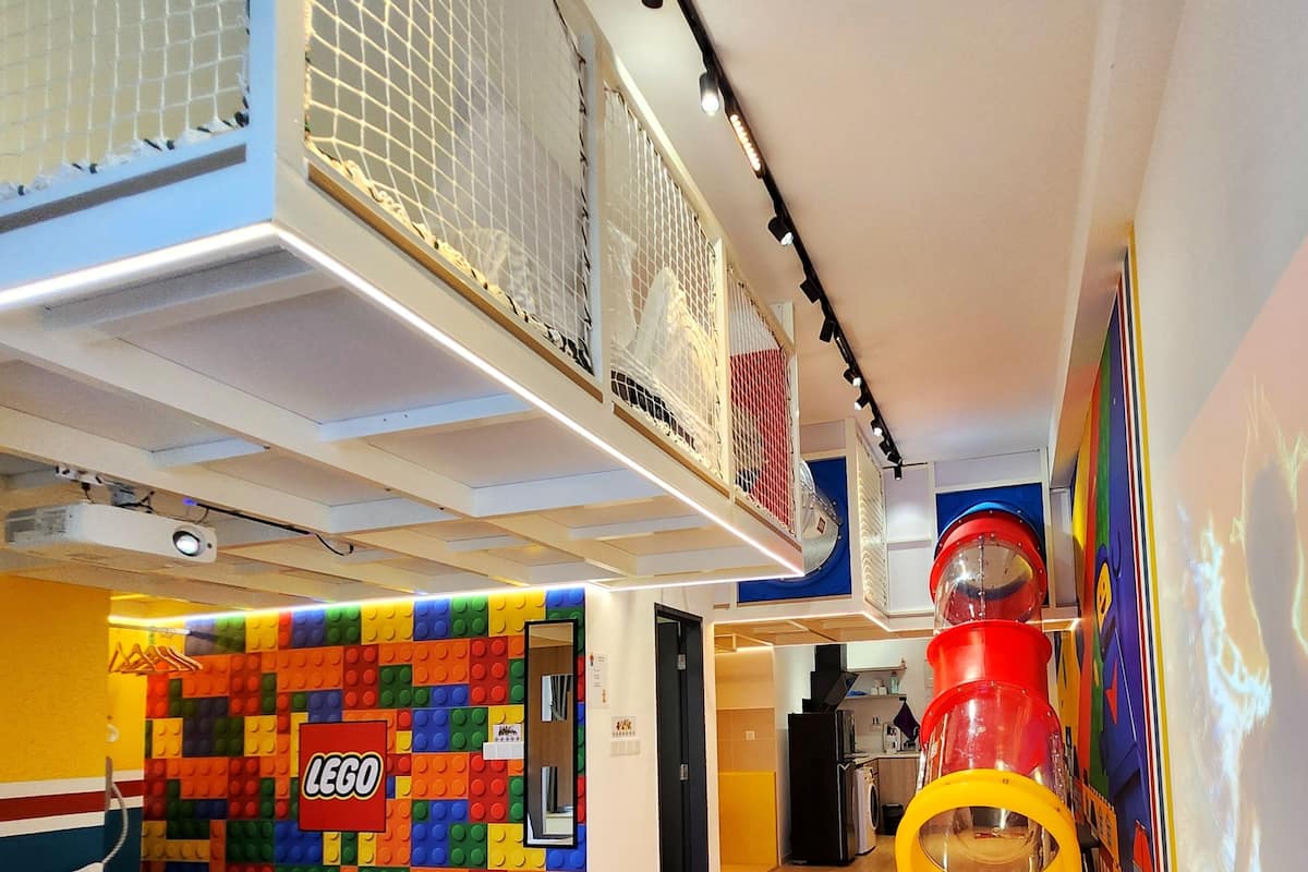 Bricks Themed Loft Apartment | Living area | 90-inch Smart TV with digital channels, TV, Netflix