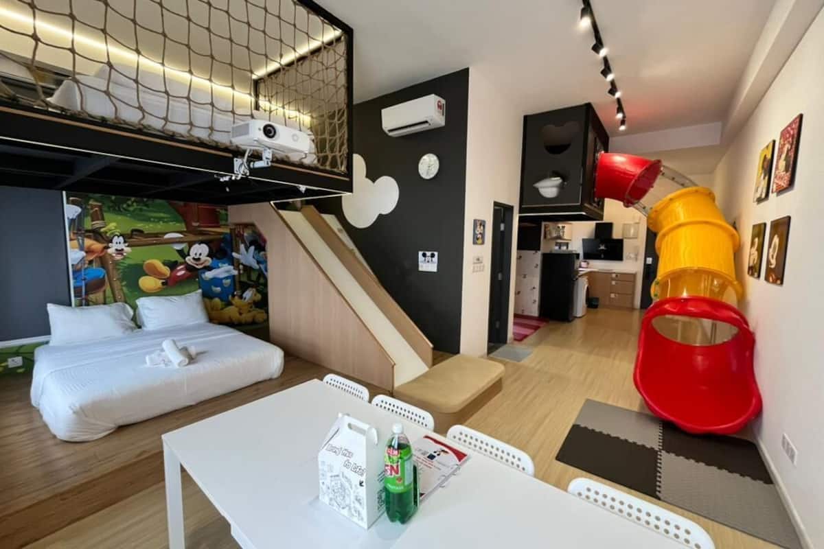 Mickey Themed Loft Apartment | Living area | 90-inch Smart TV with digital channels, TV, Netflix