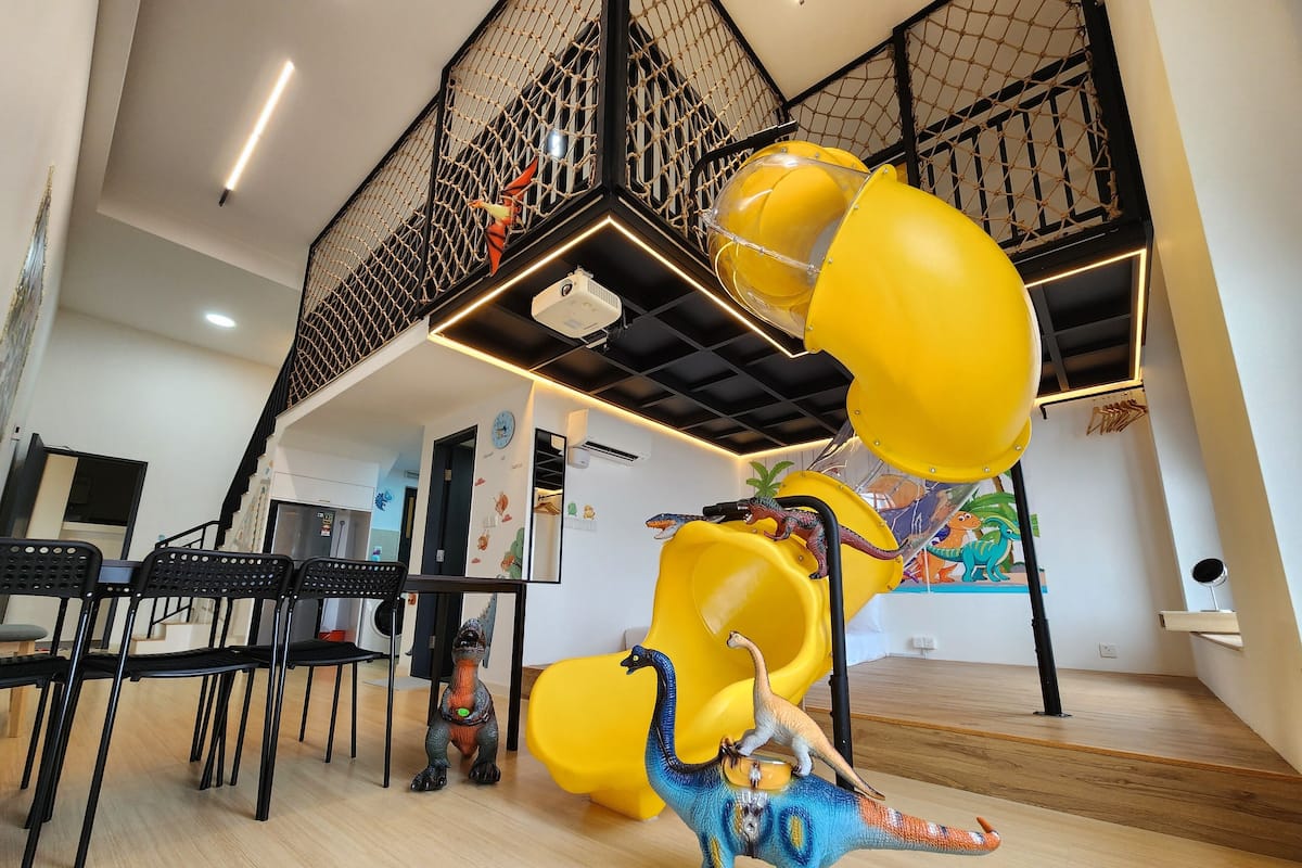 Dinosaur Themed Loft Apartment | Living area | 90-inch Smart TV with digital channels, TV, Netflix