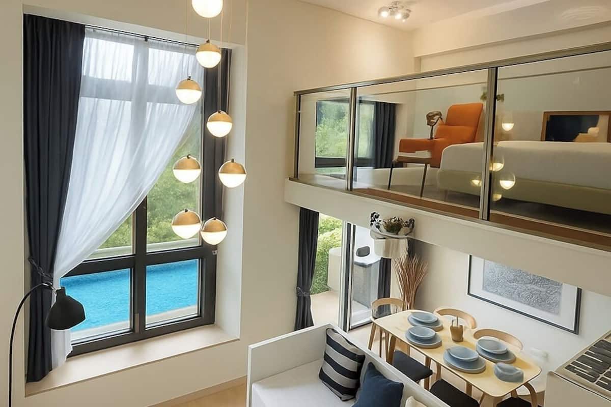 Greece at GRID Pool view luxury loft | Living area | 90-inch Smart TV with digital channels, TV, Netflix