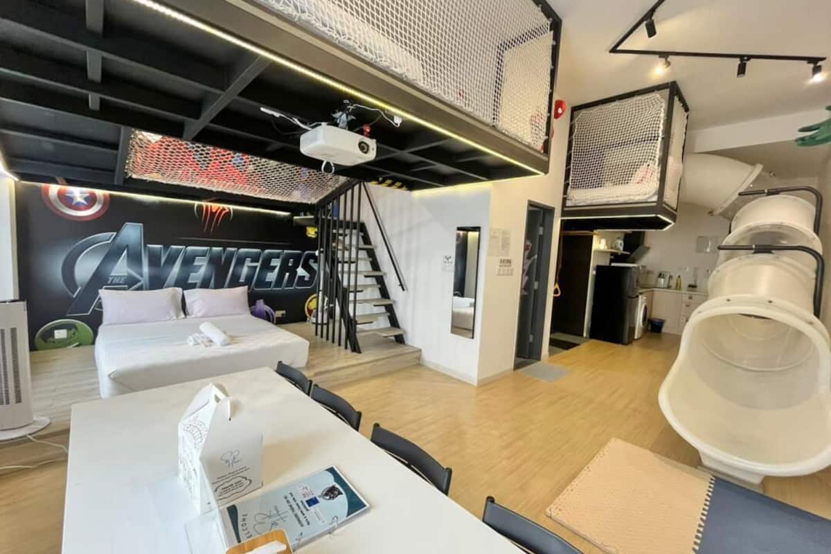 Avengers Themed Loft Apartment | Living area | 90-inch Smart TV with digital channels, TV, Netflix
