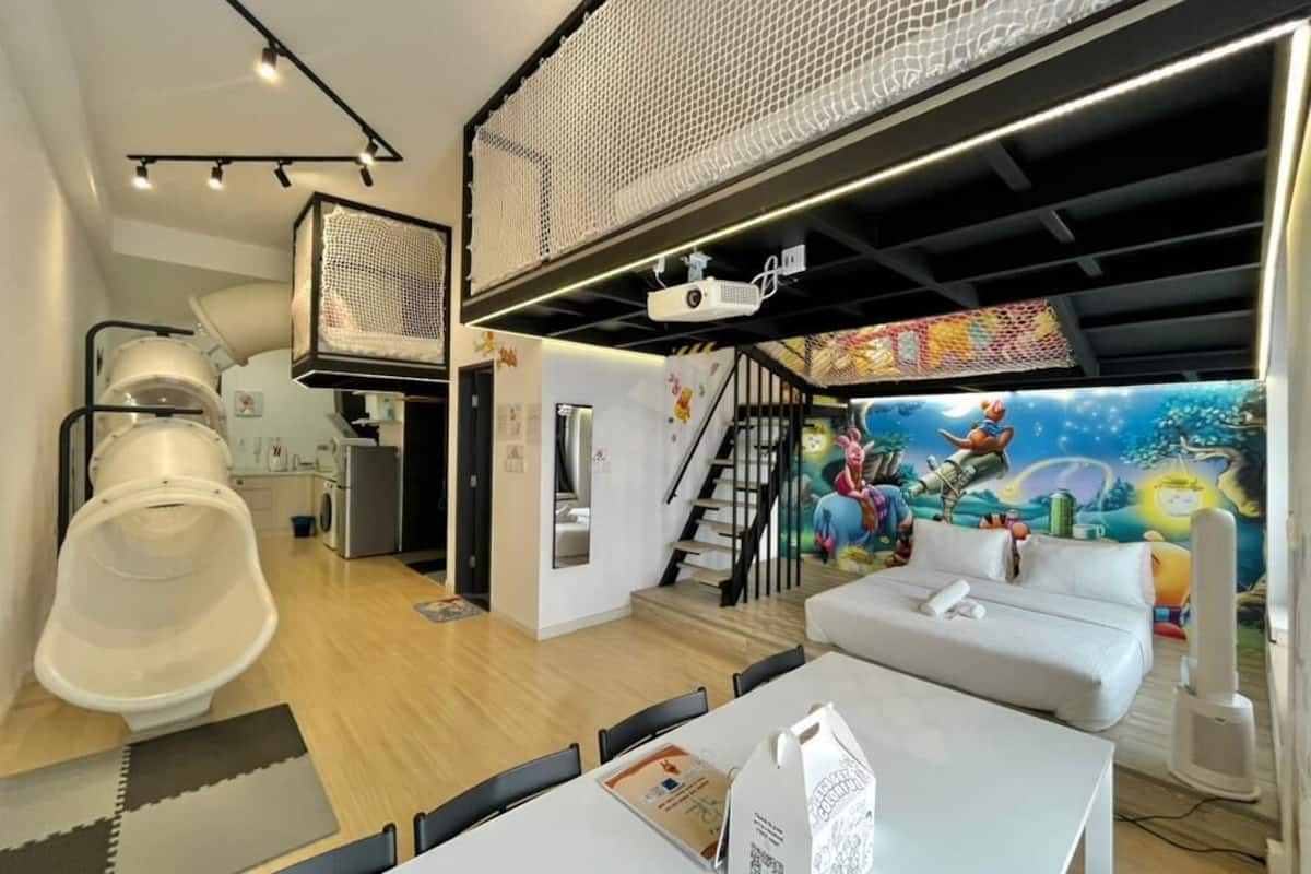 Winnie Pooh Themed Loft Apartment | Living area | 90-inch Smart TV with digital channels, TV, Netflix