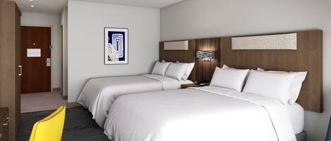 A hotel room with two beds, a wooden headboard, a wall-mounted artwork, and a yellow chair.