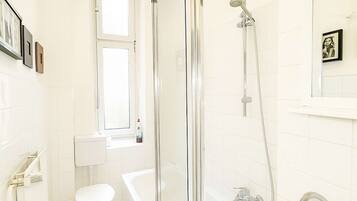 Bathtub, hair dryer, towels