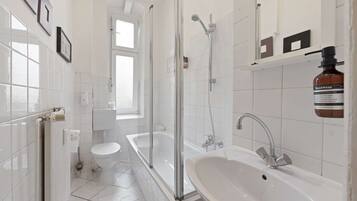 Bathtub, hair dryer, towels