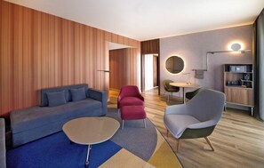 Suite, 1 Double Bed, River View | Living area | 50-inch flat-screen TV with satellite channels, TV
