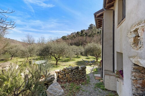 Ferienhaus 'Del Fiume' mit Bergblick und Privatem Garten