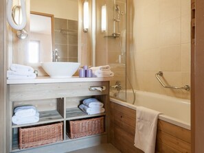 Shower, hair dryer, towels, toilet paper