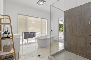Shower, hair dryer, towels, soap