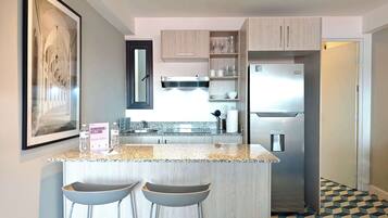 Fridge, microwave, stovetop, coffee/tea maker