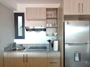 Fridge, microwave, stovetop, coffee/tea maker