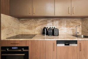 Coffee/tea maker, fridge, microwave, oven