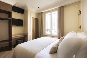A hotel room with a bed, a television, a window, and a door. - Merveil - Luxury Suite - Marais - Ponceau (Paris)