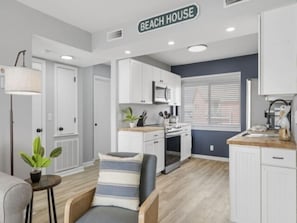 Enjoy cooking in this well-equipped kitchen with an oven, sink, and ample countertop space.