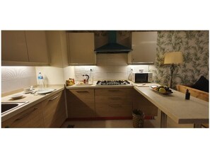 Fridge, microwave, electric kettle, cookware/dishes/utensils