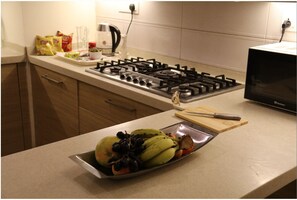 Enjoy cooking in this fully equipped kitchen with a gas stove, microwave, and ample countertop space.