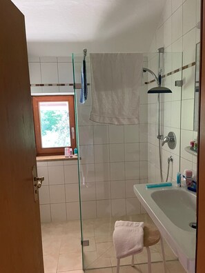 Shower, hair dryer, towels, soap