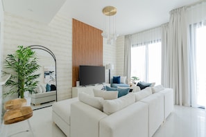 Family Townhome | Living area | 55-inch Smart TV with cable channels, TV, Netflix - Nasma Luxury Stays- Ras Al Khaimah (Ras Al Khaimah)