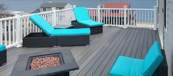 Comfortable home with rooftop deck, beach & water views, W/D, & central AC