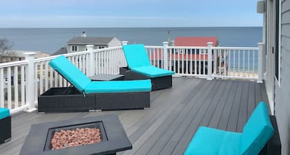Comfortable home with rooftop deck, beach & water views, W/D, & central AC