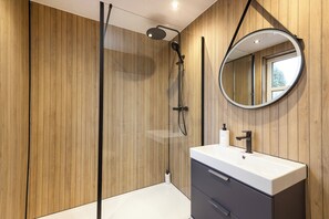 Shower, hair dryer, slippers, towels