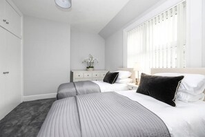 1 bedroom, desk, iron/ironing board, travel crib