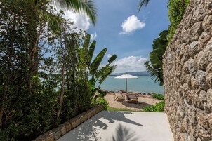 Private beach, white sand, sun loungers, beach umbrellas