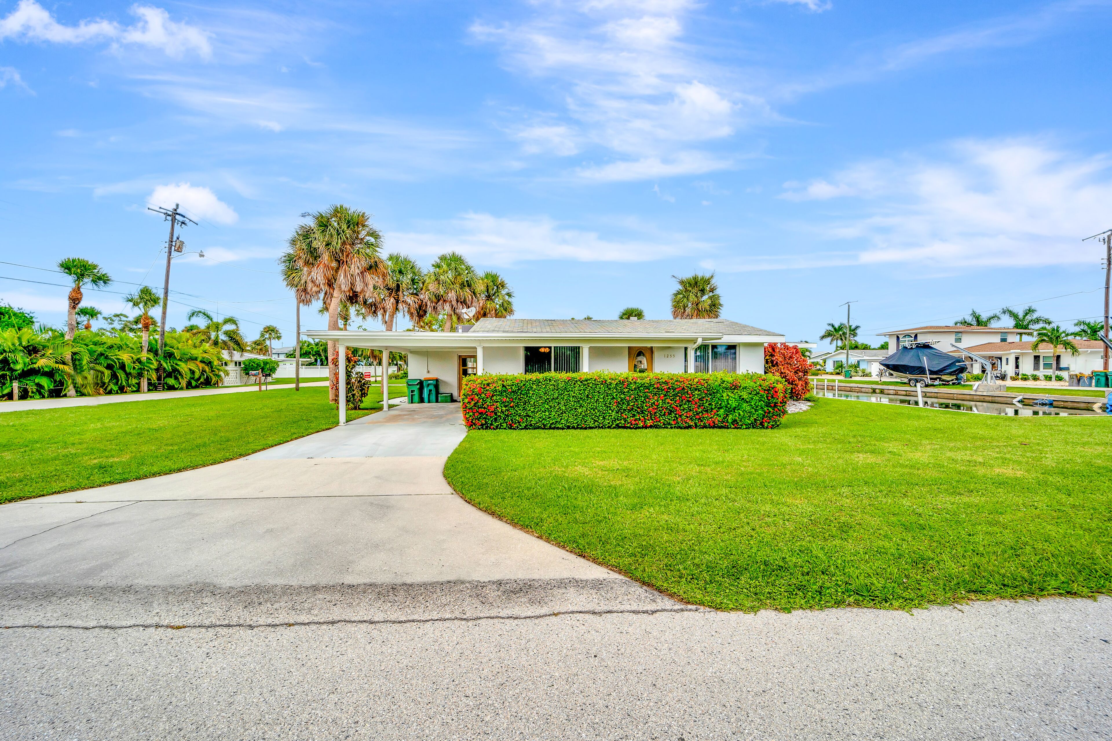 Waterfront home with canal access, patio, sun room, & central AC - near beach
