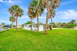 Surrounded by lush greenery, this serene residential setting offers a peaceful retreat.