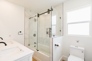 Shower, hair dryer, towels, soap