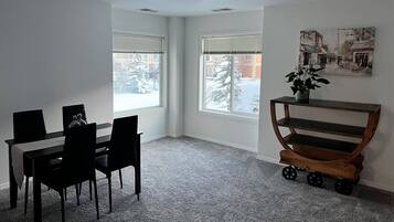 City Apartment | Living area | 65-inch TV with cable channels