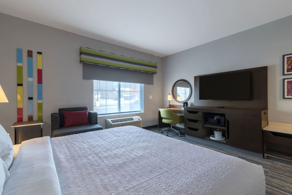 Desk, laptop workspace, blackout drapes, iron/ironing board
