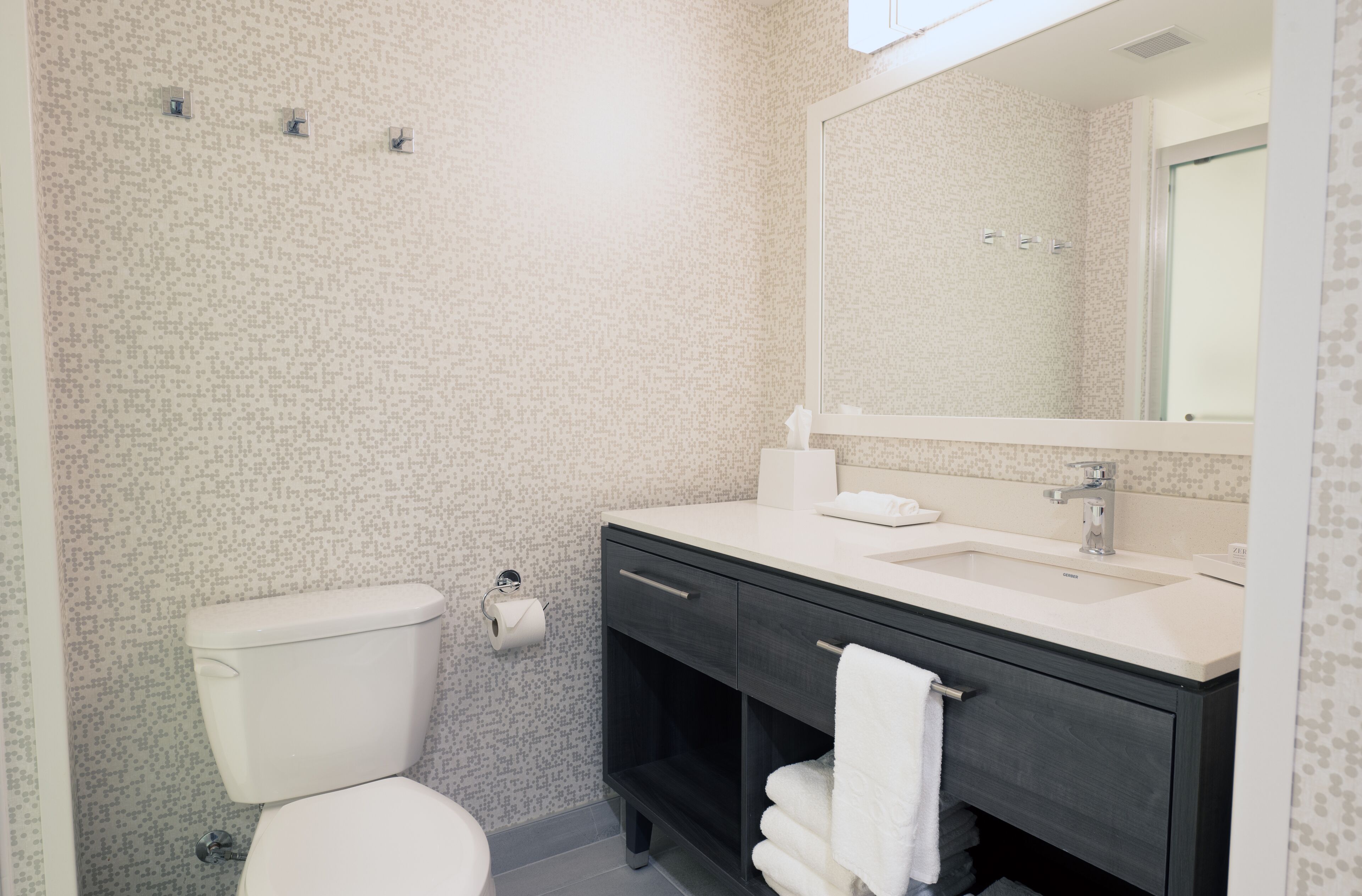 rainfall showerhead, hair dryer, towels, soap