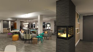 Un interior moderno con chimenea, comedor y zona de estar.
