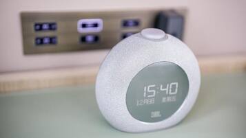 A digital clock displaying 15:40 on 12th August, with JBL branding.