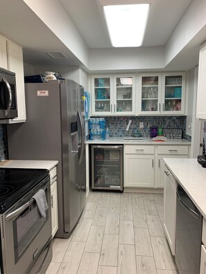 Enjoy cooking in this well-equipped kitchen with a refrigerator, oven, and dishwasher.