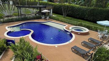 Outdoor pool, open 7:00 AM to 7:00 PM, pool umbrellas