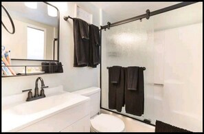 Shower, hair dryer, towels, soap