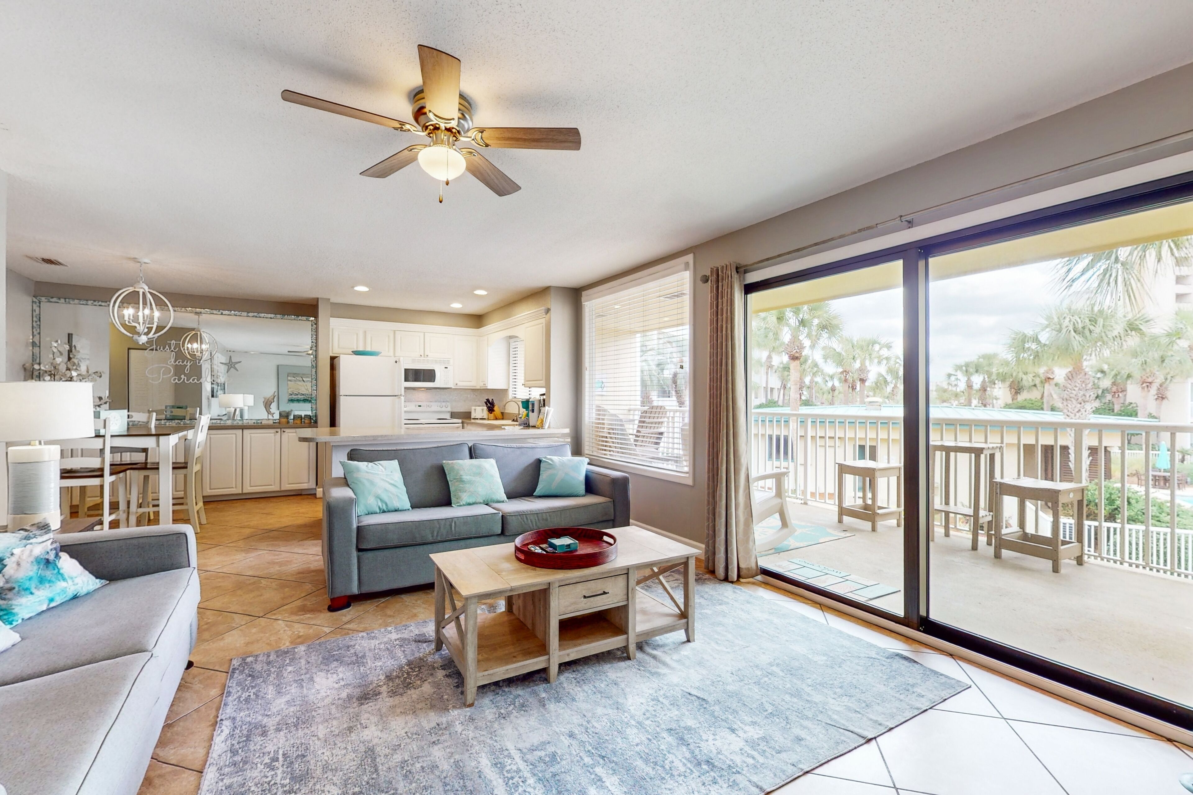 2nd-floor resort condo with large balcony, outdoor pool, tennis, gym, W/D & AC
