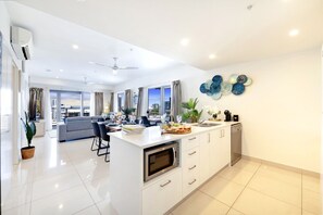 Fridge, coffee/tea maker, highchair, cookware/dishes/utensils