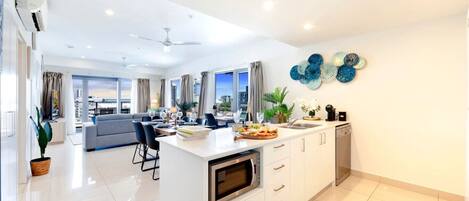 Fridge, coffee/tea maker, highchair, cookware/dishes/utensils