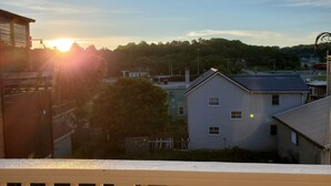 A residential area with houses and a clear sky.