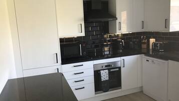 Microwave, stovetop, dishwasher, coffee/tea maker