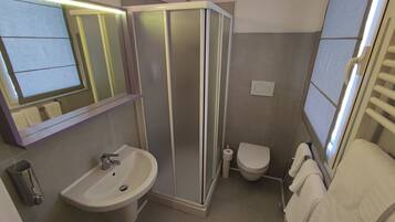 Standard Double Room | Bathroom | Shower, hair dryer, slippers, towels