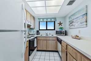 Fridge, microwave, oven, stovetop - 🌊Great Ocean View / Pool / Walk to Shopping & Dining / Ocean Trillium Condo #701🏖️ (New Smyrna Beach)